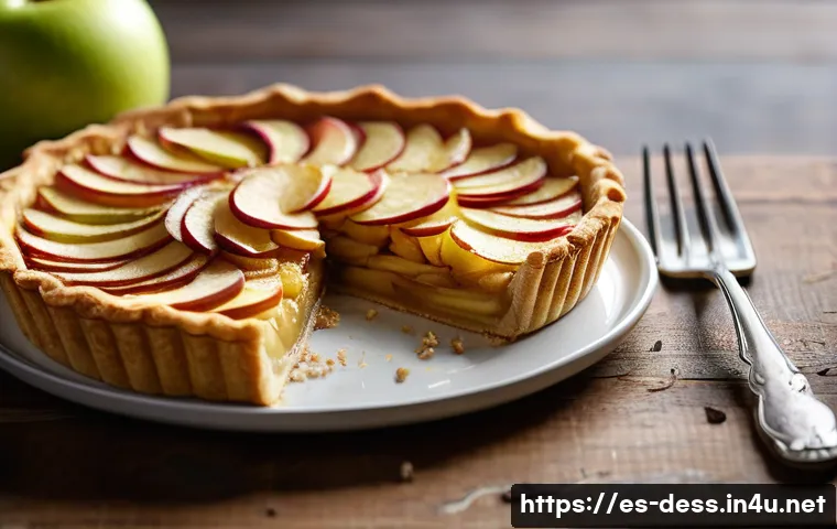 디저트 전문가로서의 감각적 표현력 키우기 - A close-up, highly detailed image of a freshly baked apple tart showcasing a golden, crispy crust wi...